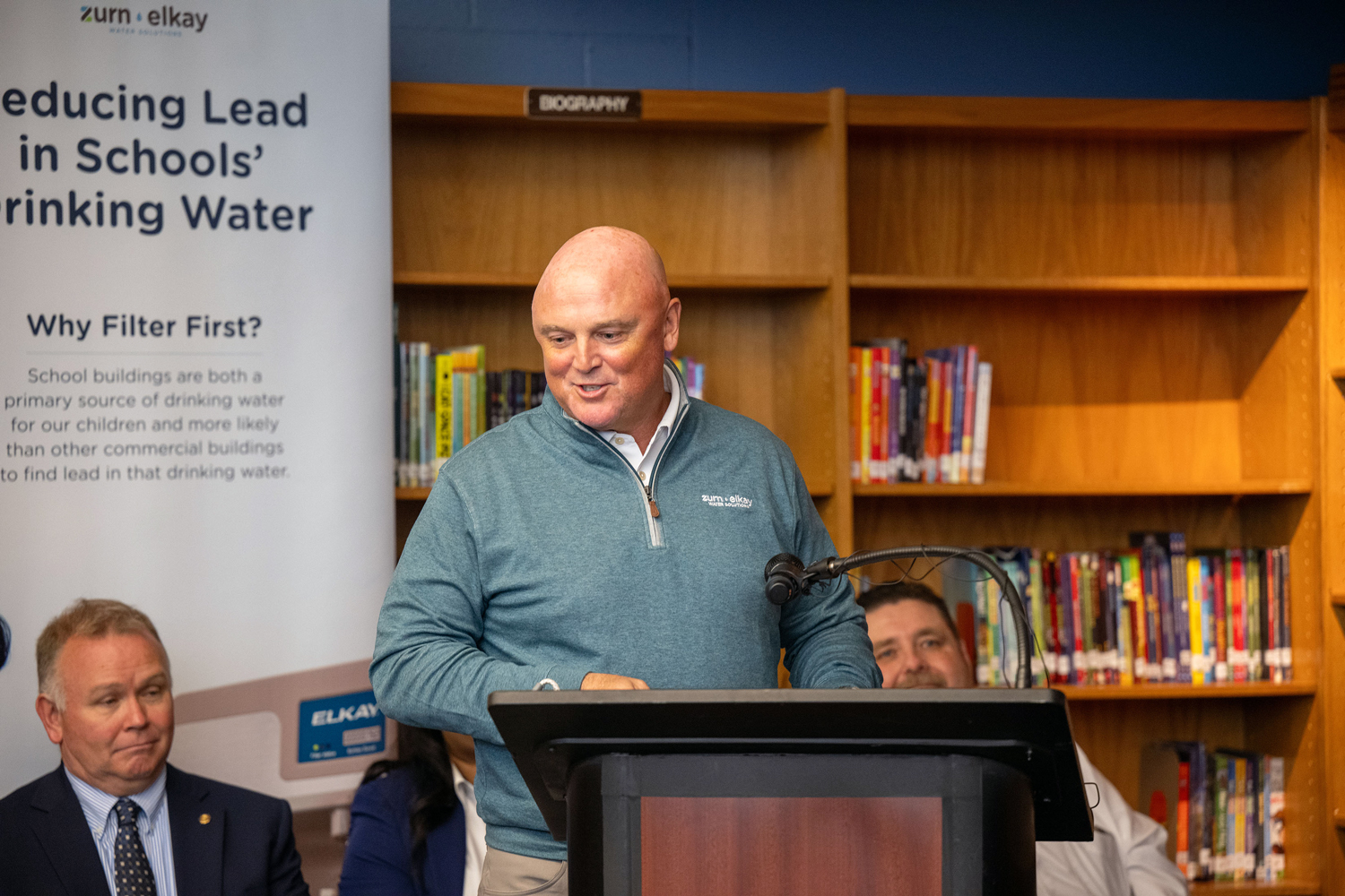Todd Adams, Chairman and CEO, addresses the press and JoAnna Connell students