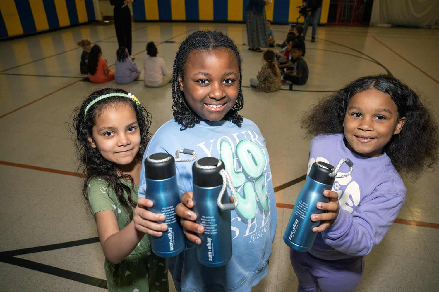 JoAnna Connell students playing in the gym with gifted reusable water bottles
