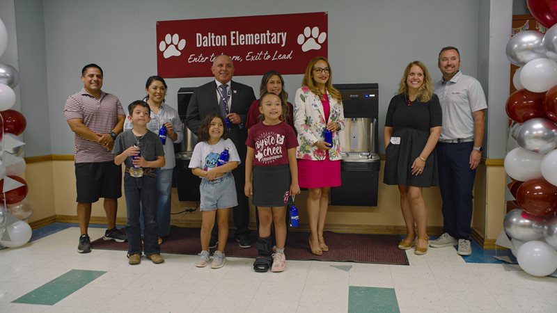 Angela Hersil, Zurn Elkay's VP - Public Affairs and Sustainability, 2nd grader Ezra Arias and Uvalde CISD Interim Superintendent Dr. Juan Hinojosa